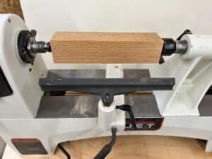 wood blank mounted on lathe