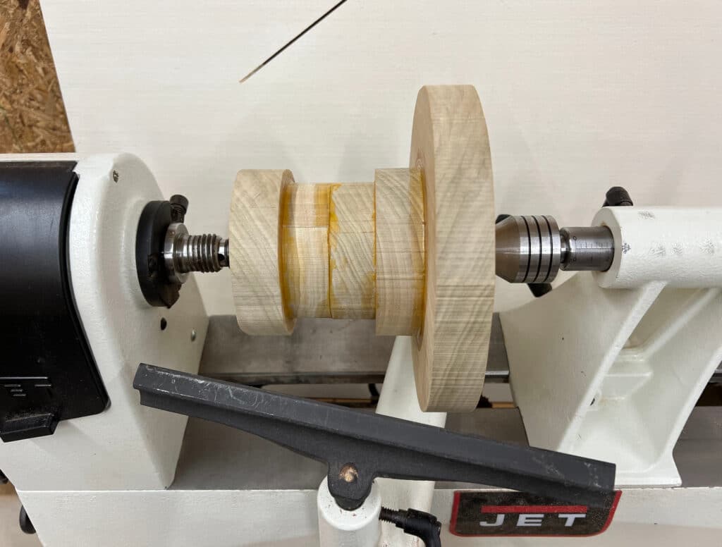 wooden pedestal stand mounted on wood lathe